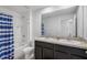 Bathroom with double vanity and shower/tub combo at 602 Olive Conch St, Ruskin, FL 33570