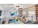Cozy sitting room with a comfortable sectional sofa and stylish decor at 5079 Eagle Rock Dr, Wimauma, FL 33598
