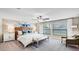 Large main bedroom with plush carpet and plenty of natural light at 5079 Eagle Rock Dr, Wimauma, FL 33598