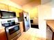 Kitchen features stainless steel appliances and light wood cabinets at 5125 Palm Springs Blvd # 9302, Tampa, FL 33647