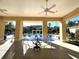 Covered patio with ping pong table overlooking the pool at 5125 Palm Springs Blvd # 9302, Tampa, FL 33647