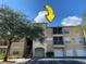 Exterior view of a three-story apartment building with parking and landscaping at 5125 Palm Springs Blvd # 9302, Tampa, FL 33647