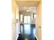View of an apartment entryway with dark hardwood floors and access to living area at 5125 Palm Springs Blvd # 9302, Tampa, FL 33647