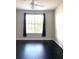 Bright bedroom with dark flooring and ceiling fan at 5125 Palm Springs Blvd # 9302, Tampa, FL 33647