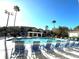Relaxing pool area with numerous blue lounge chairs at 5125 Palm Springs Blvd # 9302, Tampa, FL 33647