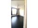 Spacious bedroom with dark flooring and large window at 5125 Palm Springs Blvd # 9302, Tampa, FL 33647