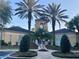 Attractive community entrance with palm trees and landscaping at 5125 Palm Springs Blvd # 9302, Tampa, FL 33647