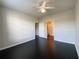 Bright bedroom with dark hardwood floors and ceiling fan at 5125 Palm Springs Blvd # 9302, Tampa, FL 33647