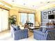 Community room with comfortable seating and a TV at 5125 Palm Springs Blvd # 9302, Tampa, FL 33647