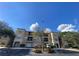 Front view of the condo building on a sunny day at 5125 Palm Springs Blvd # 9302, Tampa, FL 33647