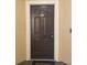 Image of a dark brown apartment entrance door with number 302 at 5125 Palm Springs Blvd # 9302, Tampa, FL 33647