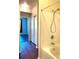 Bathroom with a bathtub and bedroom access at 5125 Palm Springs Blvd # 9302, Tampa, FL 33647