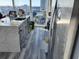 Modern kitchen with white quartz countertops and gray cabinets at 777 N Ashley Dr # 1103, Tampa, FL 33602