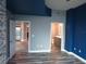 Gray and blue bedroom with wood-look floors, bathroom access at 777 N Ashley Dr # 1103, Tampa, FL 33602