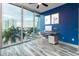 Modern home office with blue walls, a desk, and city views at 777 N Ashley Dr # 1103, Tampa, FL 33602