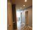 Hallway with gray walls, wood flooring, and access to kitchen at 777 N Ashley Dr # 1103, Tampa, FL 33602