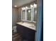 Double vanity bathroom with a large mirror and frameless shower at 777 N Ashley Dr # 1103, Tampa, FL 33602