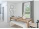 Bright dining room with wood table and abstract wall art at 2530 Leonia Ln, Zephyrhills, FL 33541