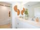 Modern bathroom with double vanity and a large mirror at 2530 Leonia Ln, Zephyrhills, FL 33541