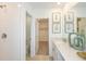 Modern bathroom with double vanity and walk-in shower at 2530 Leonia Ln, Zephyrhills, FL 33541
