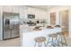 Modern kitchen with white cabinets and center island at 2530 Leonia Ln, Zephyrhills, FL 33541