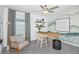 Home office with a desk, chair, and plenty of natural light at 2530 Leonia Ln, Zephyrhills, FL 33541