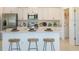 Modern kitchen with white cabinets and center island at 2530 Leonia Ln, Zephyrhills, FL 33541