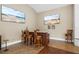 Wet bar with seating for three and wall mounted TVs at 11623 Innfields Dr, Odessa, FL 33556