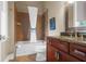 Bathroom with shower, tub, and granite vanity at 11623 Innfields Dr, Odessa, FL 33556
