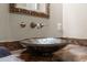 Elegant bathroom sink with a unique glass bowl and granite countertop at 11623 Innfields Dr, Odessa, FL 33556