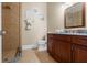 Bathroom with shower and granite vanity at 11623 Innfields Dr, Odessa, FL 33556