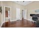Bedroom with hardwood floors, and access to a bathroom at 11623 Innfields Dr, Odessa, FL 33556