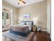 Spacious bedroom with hardwood floors and French doors at 11623 Innfields Dr, Odessa, FL 33556