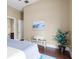 Bedroom with hardwood floors and ensuite bathroom at 11623 Innfields Dr, Odessa, FL 33556