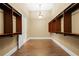 Spacious walk-in closet with custom shelving and lighting at 11623 Innfields Dr, Odessa, FL 33556
