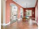 Elegant dining room with terracotta tile floors and access to backyard pool at 11623 Innfields Dr, Odessa, FL 33556