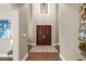 Bright and spacious entryway with high ceilings and double doors at 11623 Innfields Dr, Odessa, FL 33556