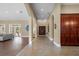 Bright entryway with tile floors and views into the living room and kitchen at 11623 Innfields Dr, Odessa, FL 33556