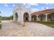 Brick paved pathway leading to the home's grand entrance at 11623 Innfields Dr, Odessa, FL 33556