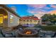 Stone fire pit with comfortable seating for outdoor enjoyment at 11623 Innfields Dr, Odessa, FL 33556