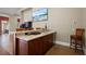Game room bar with granite countertop and wooden cabinets at 11623 Innfields Dr, Odessa, FL 33556