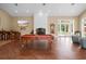 Game room with pool table, fireplace and hardwood floors at 11623 Innfields Dr, Odessa, FL 33556