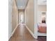 Bright hallway with tile floors and access to bedrooms and living areas at 11623 Innfields Dr, Odessa, FL 33556