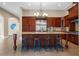 Spacious kitchen features a large island, granite countertops, and stainless steel appliances at 11623 Innfields Dr, Odessa, FL 33556