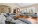 Open living room with hardwood floors and ample seating at 11623 Innfields Dr, Odessa, FL 33556