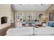 Living room with hardwood floors, large windows, and comfortable seating at 11623 Innfields Dr, Odessa, FL 33556