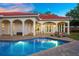 Inviting pool area with lounge chairs, surrounded by a spacious patio at 11623 Innfields Dr, Odessa, FL 33556