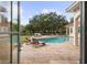 Inviting pool area with lounge chairs and lush landscaping at 11623 Innfields Dr, Odessa, FL 33556