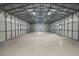Bright and spacious workshop interior with polished concrete floor at 11623 Innfields Dr, Odessa, FL 33556