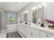 Modern bathroom with double vanity, soaking tub, and large shower at 6434 Rubia Cir, Apollo Beach, FL 33572